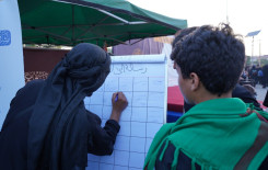 وفاءً لدمائهم الزكية المَجمَع العلميّ يبعث رسائل للشهداء في طريق الزائرين